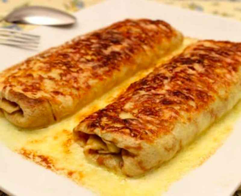 Ficelle Picarde : Recette de crêpe garnie de jambon et de champignons.